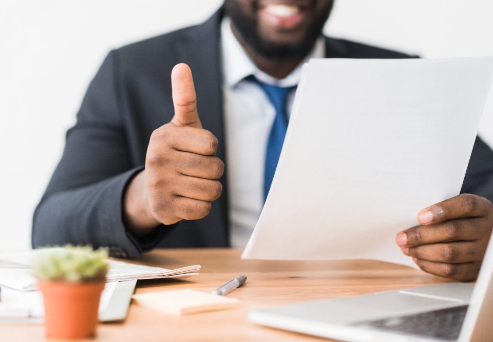 A smiling person with a press release(illustration)