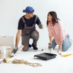 A young couple doing renovation