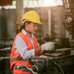 A worker is working in a Malaysian industry.