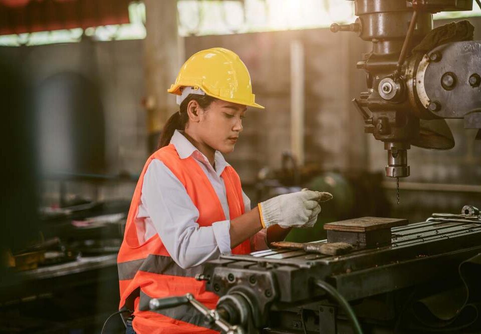 A worker is working in a Malaysian industry.